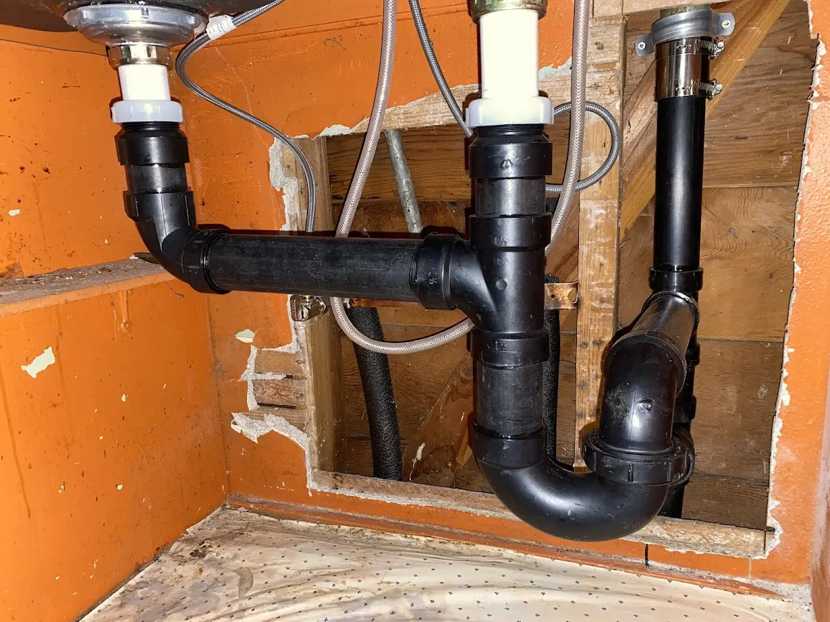 Professional Garbage Disposal Repair equipment and tools on the job in Apex